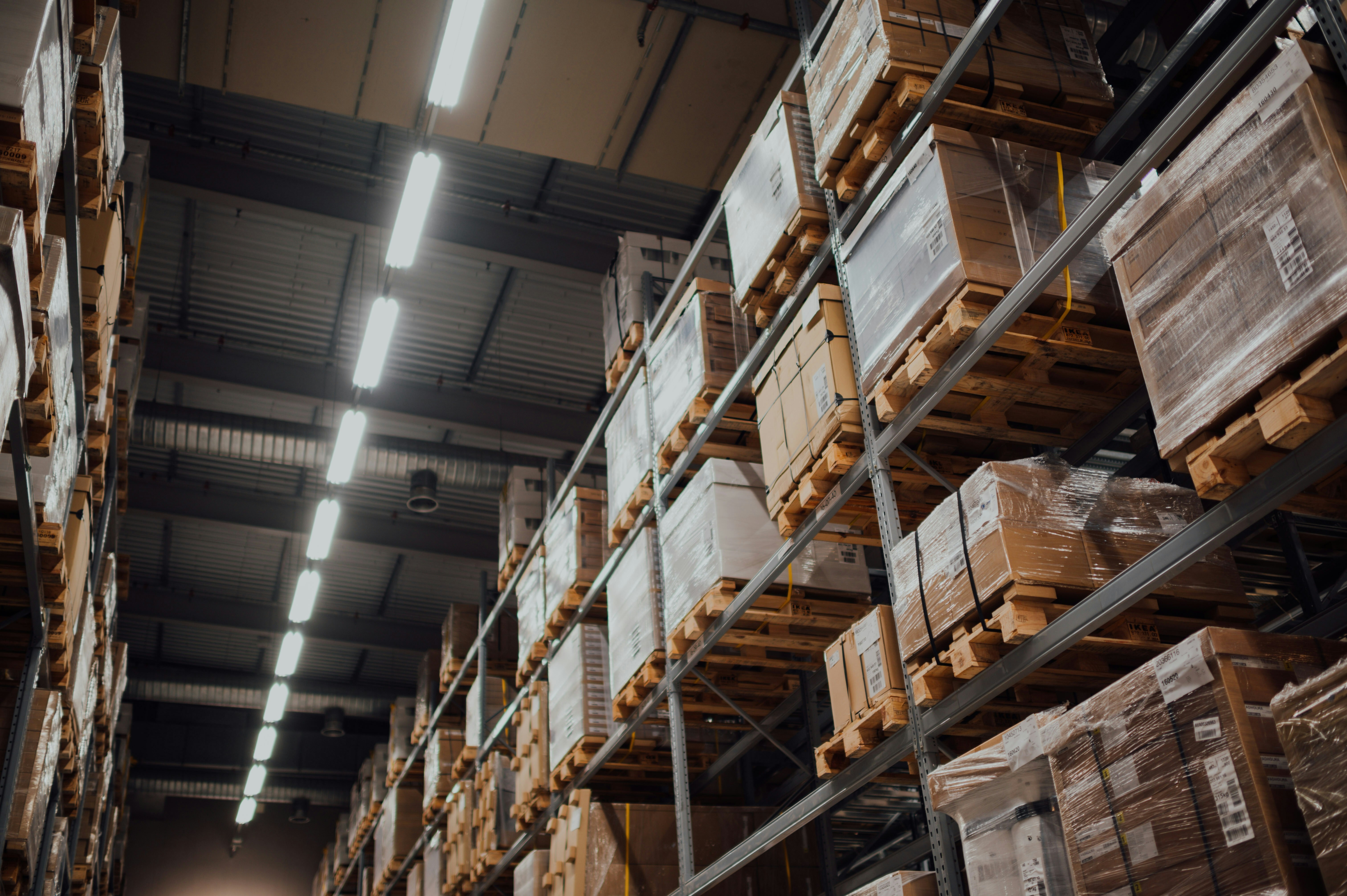 a shipping warehouse with boxed goods on crates
