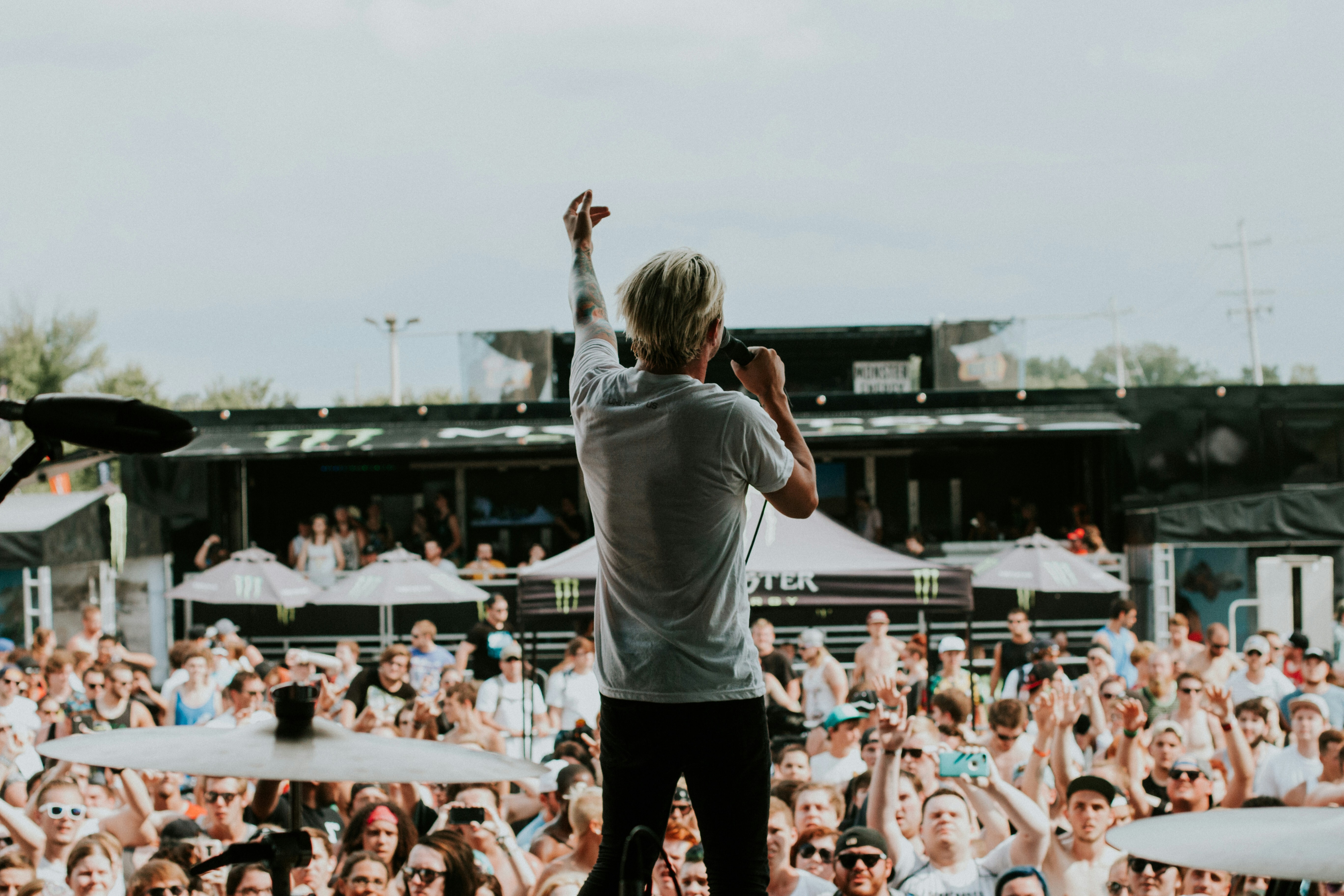 Singer standing in front of an audience at a concert