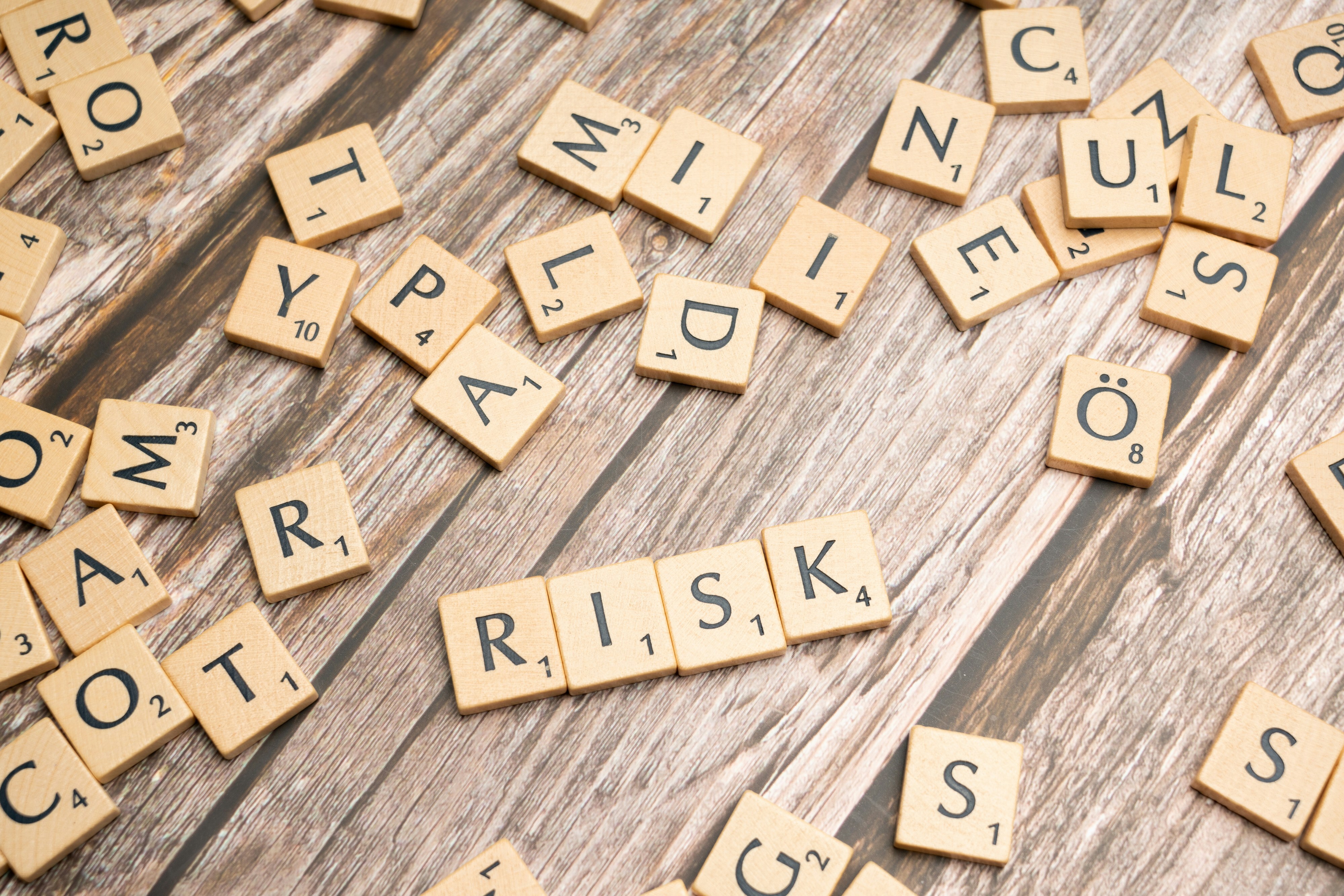 Scrabble tiles displaying the word "Risk"