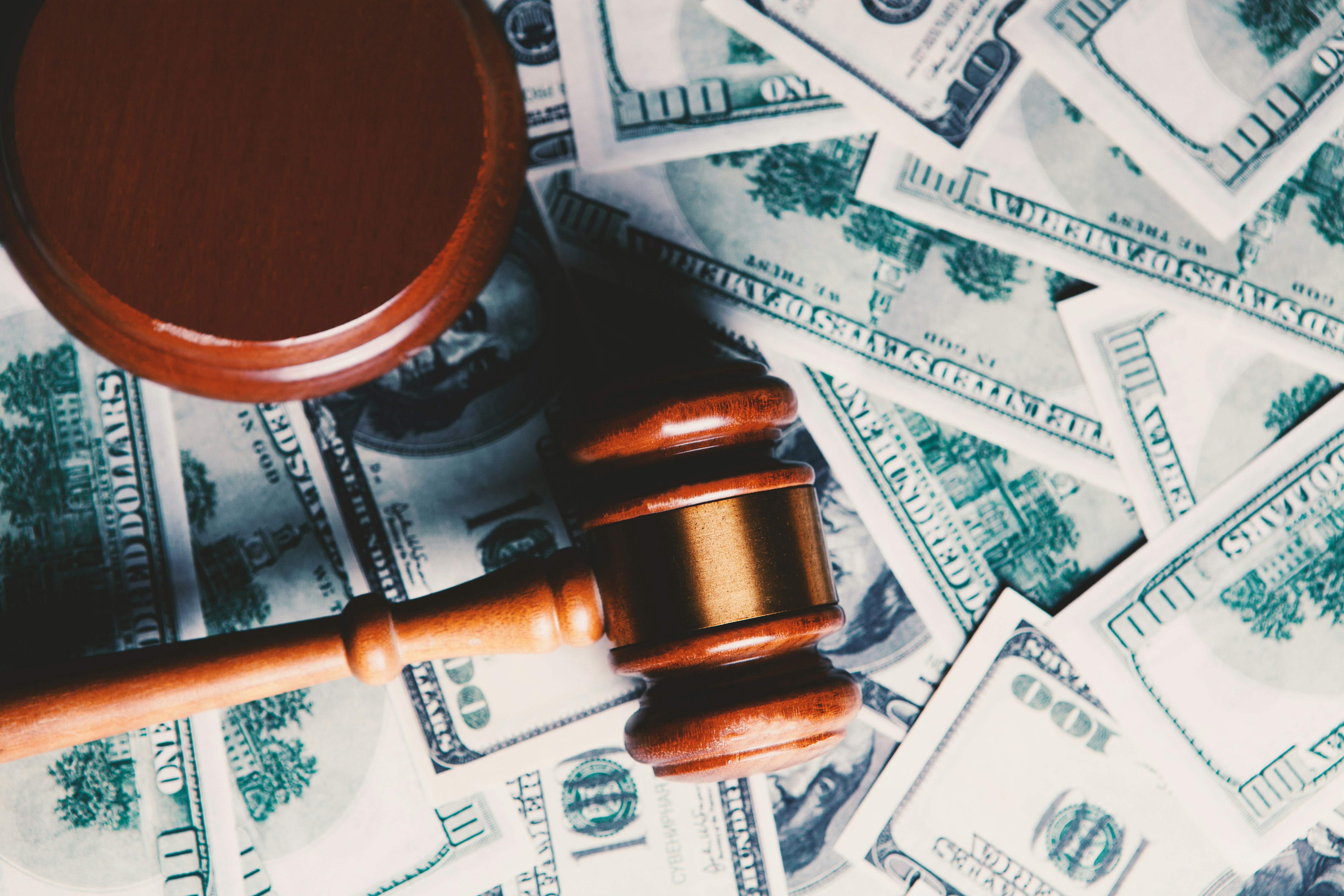A gavel on top of US currency.