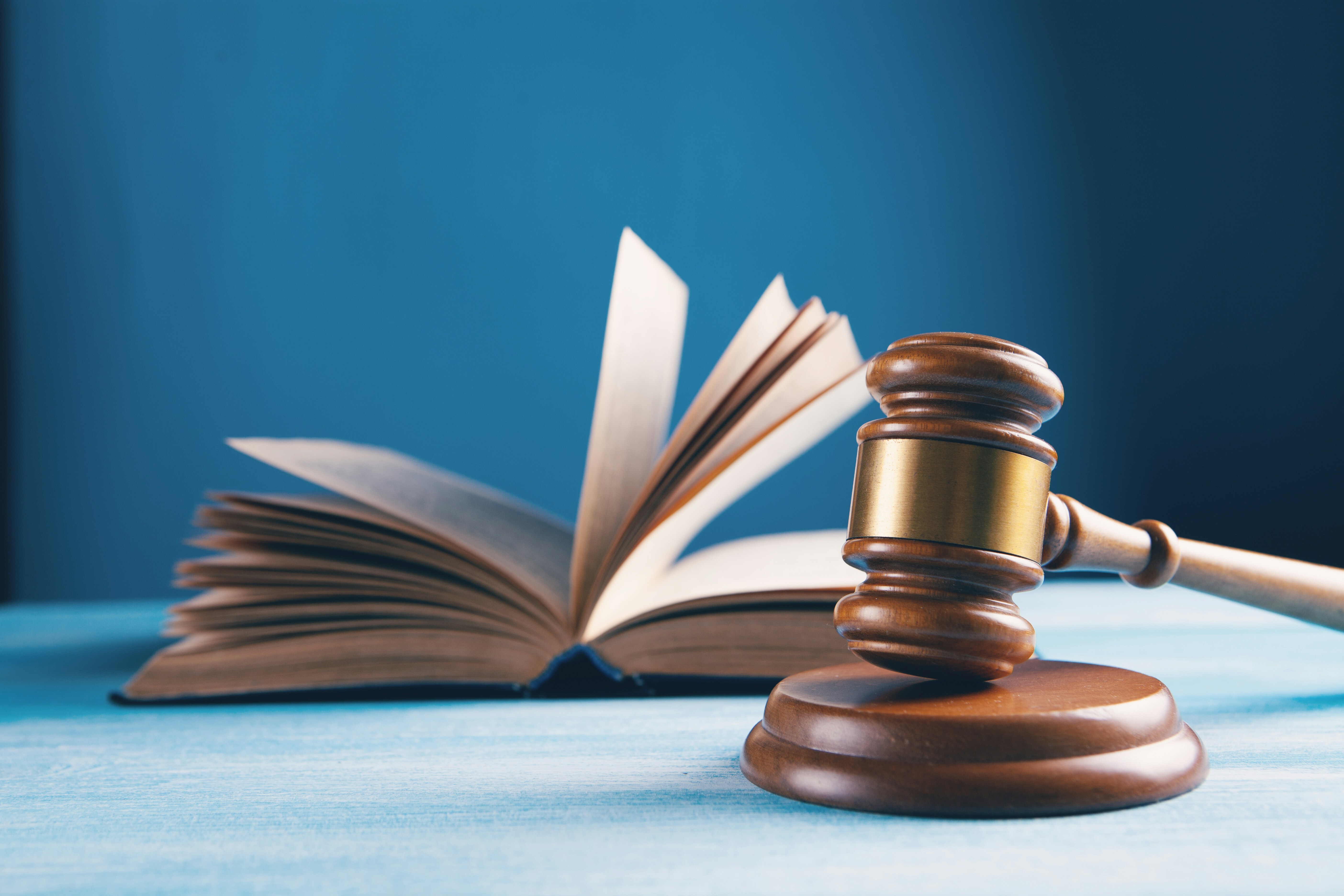 a gavel in front of a book